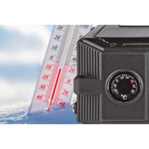 The thermometer lies on the snow in winter showing a negative te